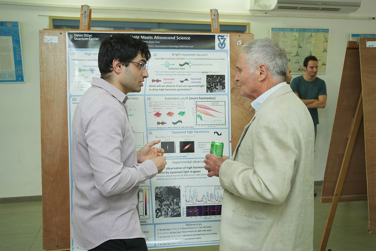 Matan-explain-his-presentation-to-Prof-Yossi-Avron